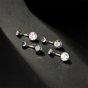 Macro detail of four-piece belly rings set with round cubic zirconia and curved bars