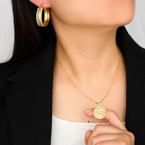 18k gold plated jewelry set featuring textured hoop earrings and round snake pendant necklace