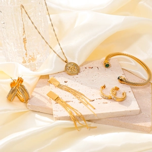 18k gold plated stainless steel jewelry set with disc necklace, earrings and cuff bracelet