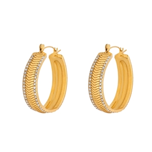 Detail of 18k gold plated hoop earrings with wave texture and pave cubic zirconia