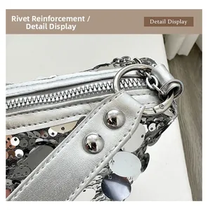 Detailed macro shot of silver sequin pillow bag with reinforced rivet and metal zipper