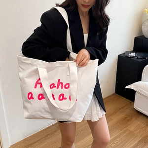 Minimalist white canvas tote bag with pink Ahaha lettering print, large capacity for women
