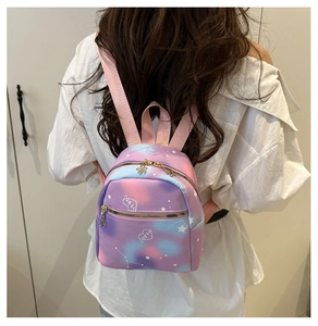 Detailed back view of a mini gradient starry backpack with white hearts and love text