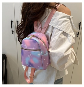 Detailed back view of mini colorful gradient backpack with heart patterns and pink straps