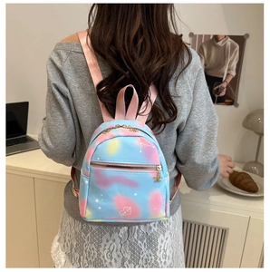 Detail view of mini backpack featuring pastel gradient colors and white star patterns