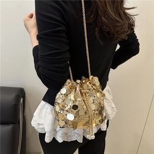 Luxury gold sequin drawstring bucket bag with chain strap and pearl accents