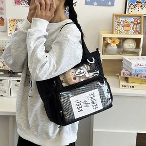 Black canvas Ita bag with large clear PVC window for doll display and pins