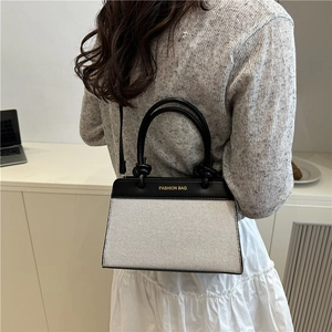 Chic black and white linen patchwork handbag with Fashion Bag text for women
