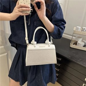 Contrast linen shell handbag with white faux leather trim and Fashion Bag gold lettering