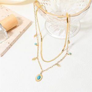 Collana turchese dorata a strati con catena a serpente piatta e ciondolo gemma blu