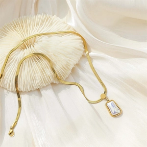 Gold stainless steel snake chain necklace with a rectangular iridescent pearl pendant