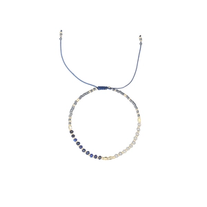 Adjustable Morse code bead bracelet with blue stone and gold metal accents on white background