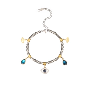 Bracelet œil porte-bonheur avec pendentifs en zircon bleu et perles en trois tons