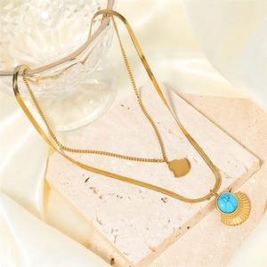 Double-layered gold stainless steel necklace with fan pendant and blue turquoise gemstone