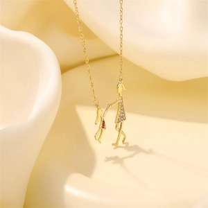 Chic gold titanium steel necklace with a crystal mother and child pendant on silk background