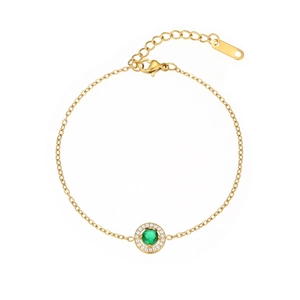 Detailed view of a gold-plated necklace with a green gemstone pendant and lobster clasp