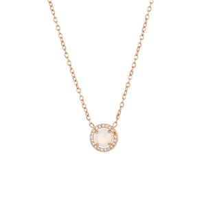 Macro shot of rose gold necklace with opal pendant surrounded by sparkling crystals