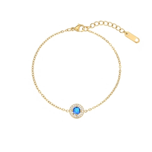 Elegant gold stainless steel bracelet with a blue gemstone pendant and zircon accents