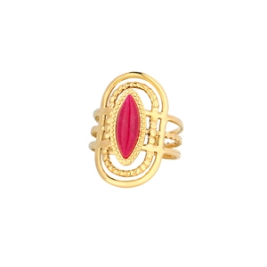 Detailed macro of gold boho ring with marquise pink stone and filigree open bands