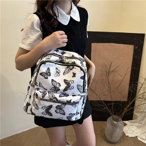 Women fashion backpack with black butterfly prints and gold zipper for school travel
