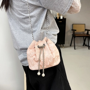Pink lace drawstring bucket bag with floral embroidery and elegant pearl accents