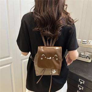Brown cute cat motif PU leather mini backpack shown on model for daily casual style