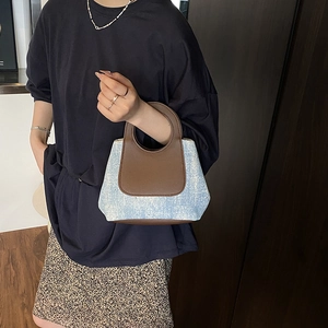 Retro denim crossbody bucket bag with blue fabric and brown leather circular handle