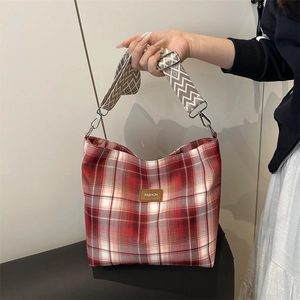 Red plaid tote bag with wide jacquard strap and vintage canvas texture for women