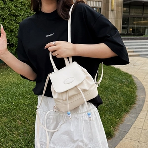 Vintage style cream PU leather mini bucket backpack for women with drawstring and blue bead