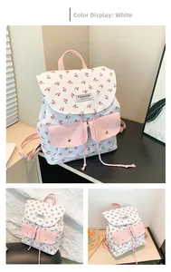 Detail view of large capacity floral backpack in white and pink with fashion patch