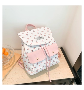 Detail of floral backpack with pink magnetic pockets and Fashion Instinct label