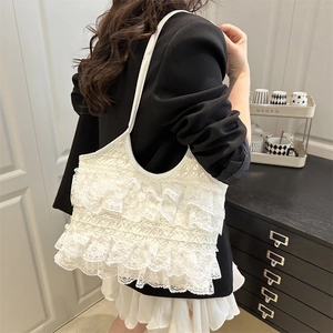 French style white lace tiered ruffled tote bag shown on model in home setting