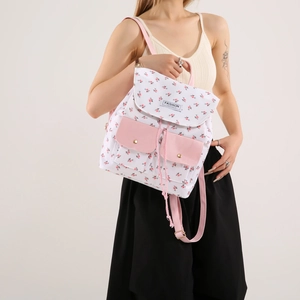Floral print canvas backpack with pink pockets and drawstring closure for women