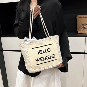 Woven straw tote bag with Hello Weekend print and lace trim detail for summer