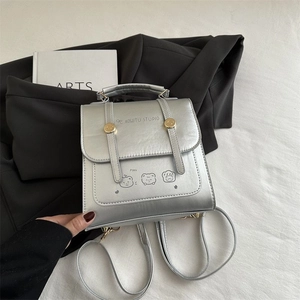 Silver PU leather mini backpack with cartoon bears and metallic cylindrical buckle detail