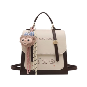 Retro color-block backpack in beige and dark brown PU leather with plush doll charm