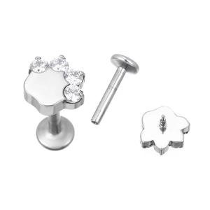 Polished G23 titanium flat back stud with sparkling cubic zirconia animal paw print