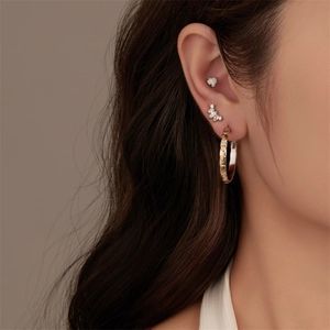 G23 titanium piercing set with gold heart ring, opal heart stud, and silver butterfly