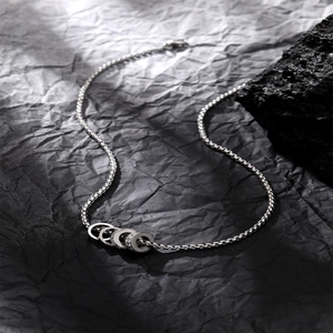Minimalist silver Venetian box chain necklace with four interlocking rings and zircon