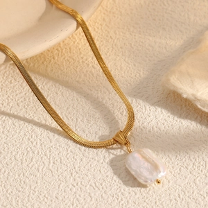 Elegant gold snake chain necklace with a unique rectangular baroque pearl pendant