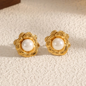 Elegant gold flower stud earrings with central pearl, minimalist luxury floral jewelry
