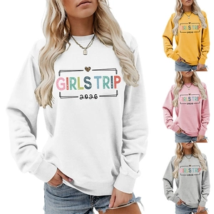 Detail view of the colorful Girls Trip 2026 print on a comfy white women's sweatshirt