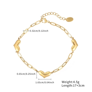 Gold paperclip link bracelet featuring three heart charms with full size dimensions