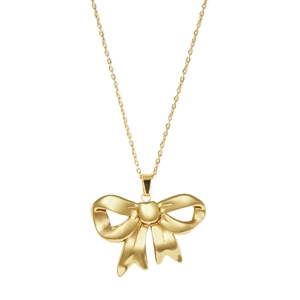 Polished gold bow pendant necklace with fine chain on a clean white background