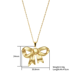 Golden 3D bow pendant necklace in stainless steel with elegant wavy texture detail