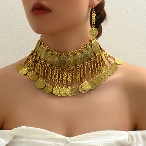 Vintage gold-toned bohemian necklace and earrings set with circular coin pendants