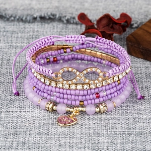 Multi-layer purple beaded bracelet set with sparkling infinity symbol and heart charm