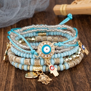 Bracelet Bohème Multicouche en Perles pour Femmes Alliage Mauvais Œil Main de Fatima Cœur Charm Élastique Bijoux Ethniques