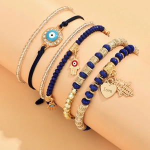 Ensemble de bracelets bohèmes dorés avec charms œil maléfique et main de hamsa