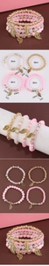 Detail of 4-pack pink beaded bracelets with golden leaf charms and 18cm sizing details